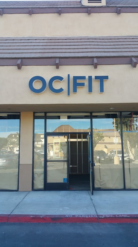 Signage lettering of that says “OC|FIT”