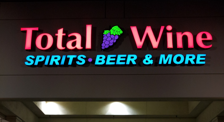 Light-up signage for Total Wine with a grape symbol